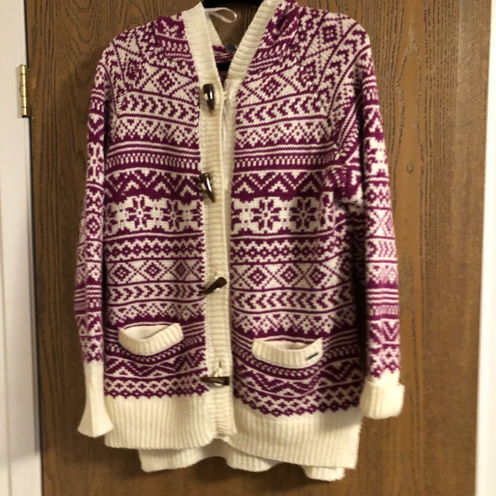 A purple and white sweater with a hood.
